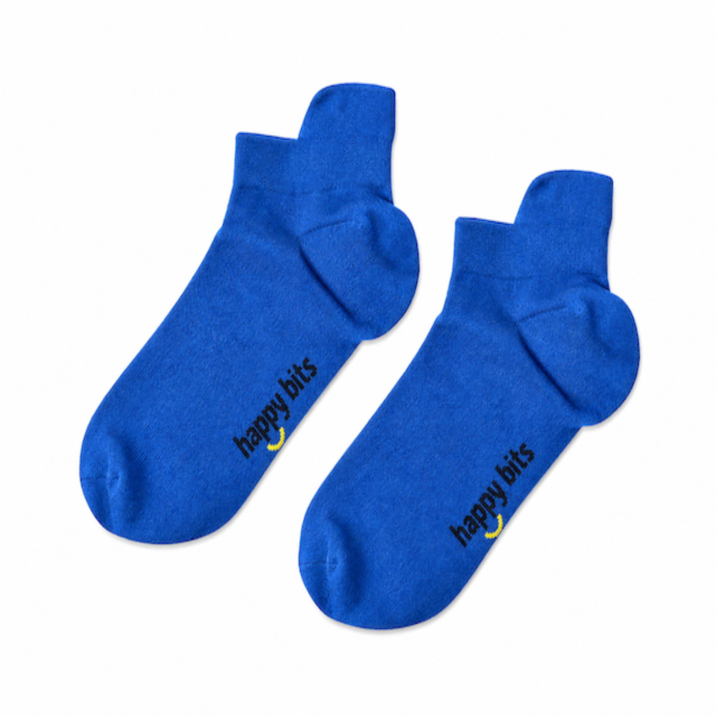 A pair of blue ankle bamboo socks on a plain white background, featuring the text 'happy bits' printed in black with a small yellow smiley face logo near the heel.